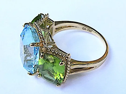 Elegant Three-Stone Ring with Gold Rope Twist Border with Blue Topaz and Peridot