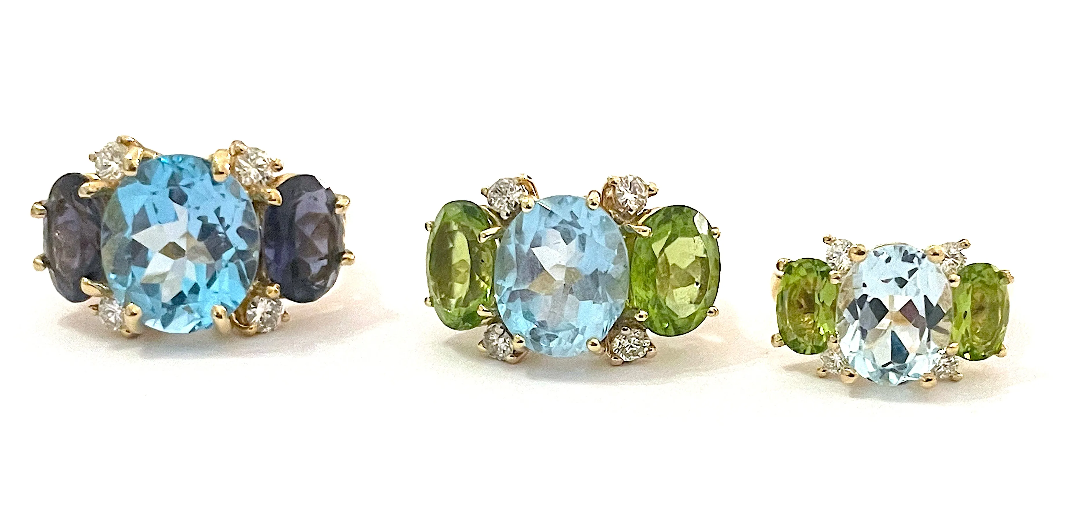 Elegant Three-Stone Ring with Gold Rope Twist Border with Blue Topaz and Peridot