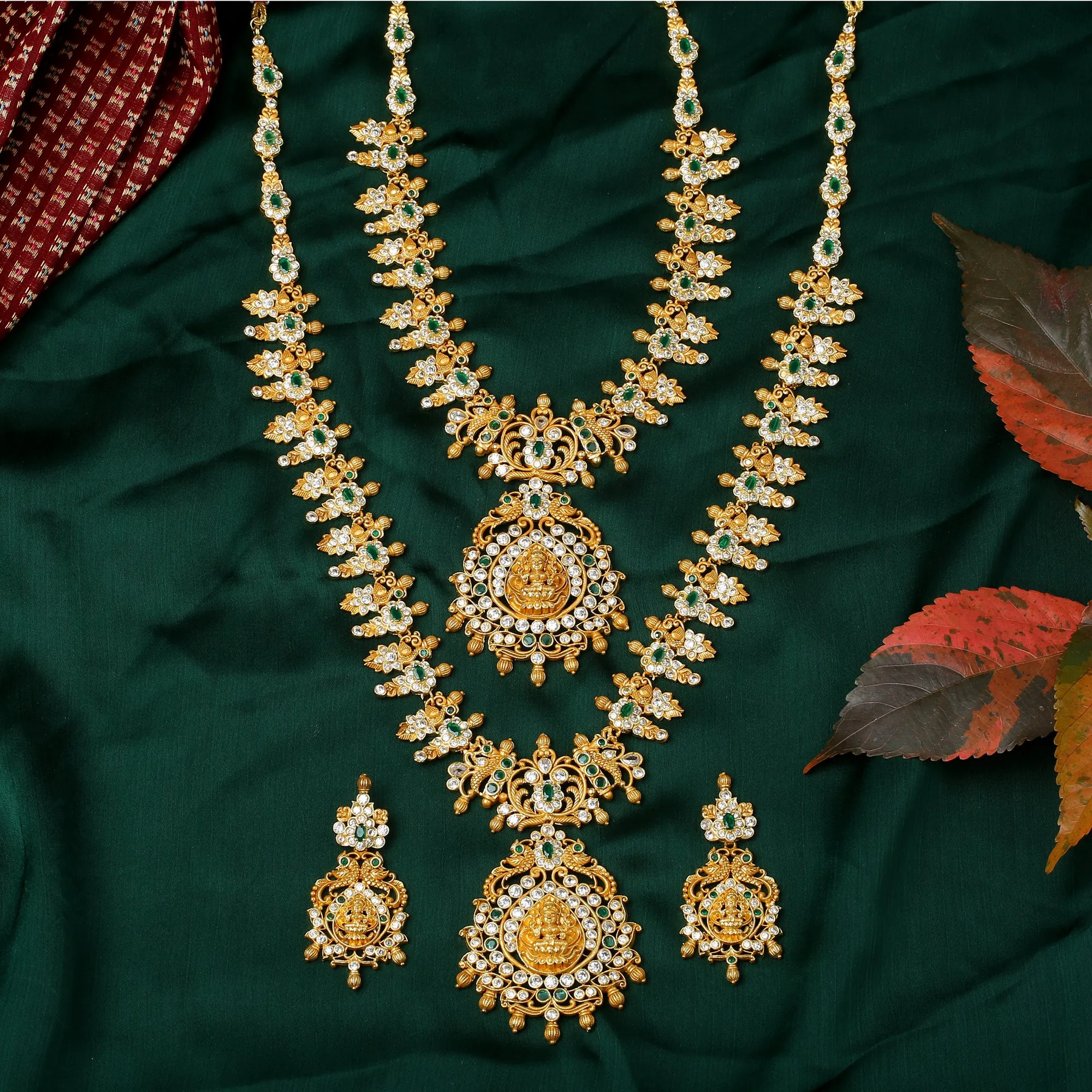 Estele Gold Plated CZ Divinity Laxmi Ji Designer Bridal Short & Long Necklace set with Green Stones for Women